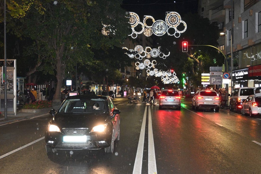 Crowds gathered at Marbella's Christmas lights despite the threat of rain.