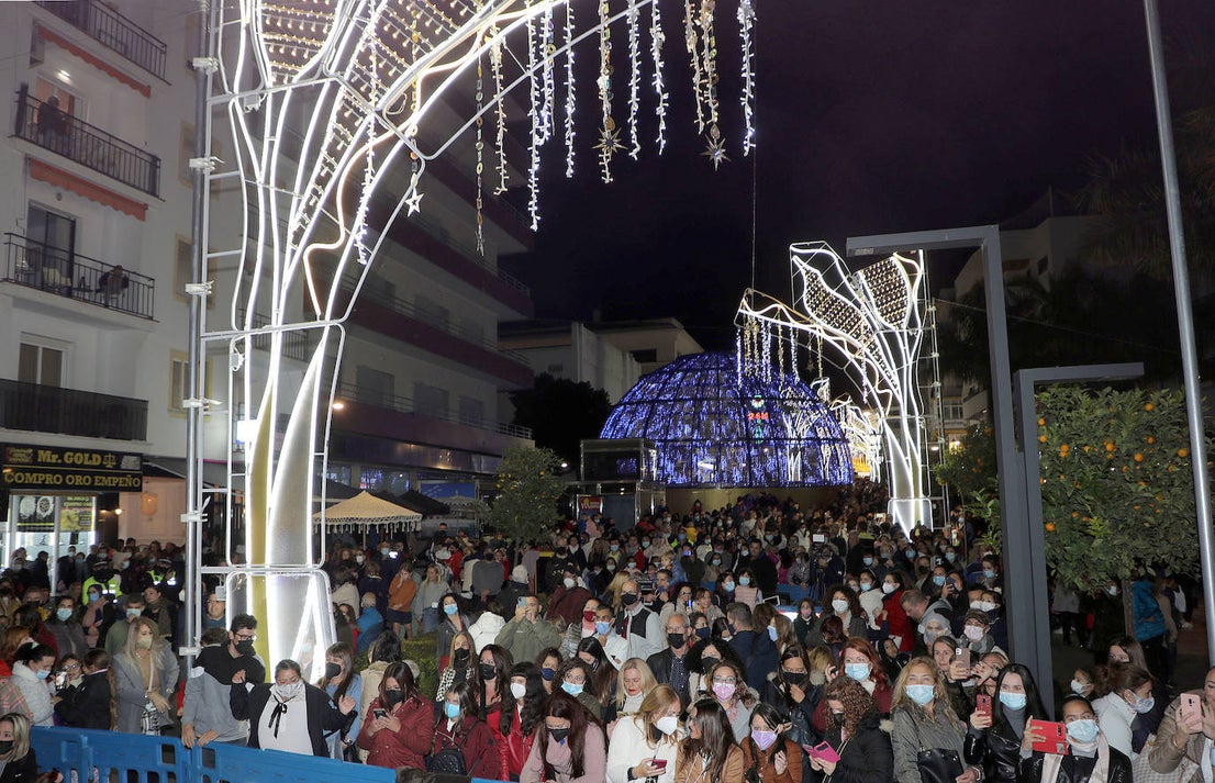 Crowds gathered at Marbella's Christmas lights despite the threat of rain.