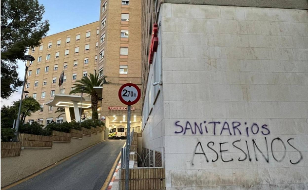 One of the spray-painted messages outside a Malaga hospital.