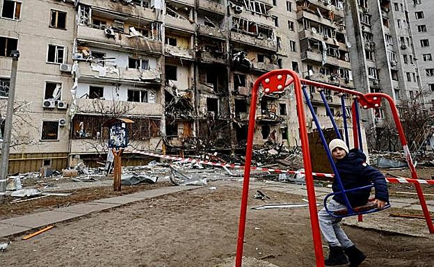 Heavily damaged apartment building after overnight attacks.