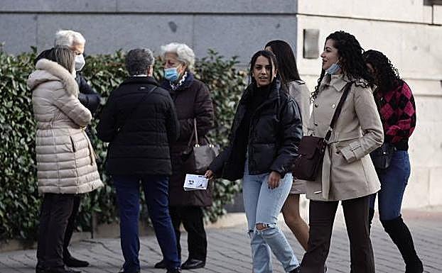 People walking in a Madrid street.