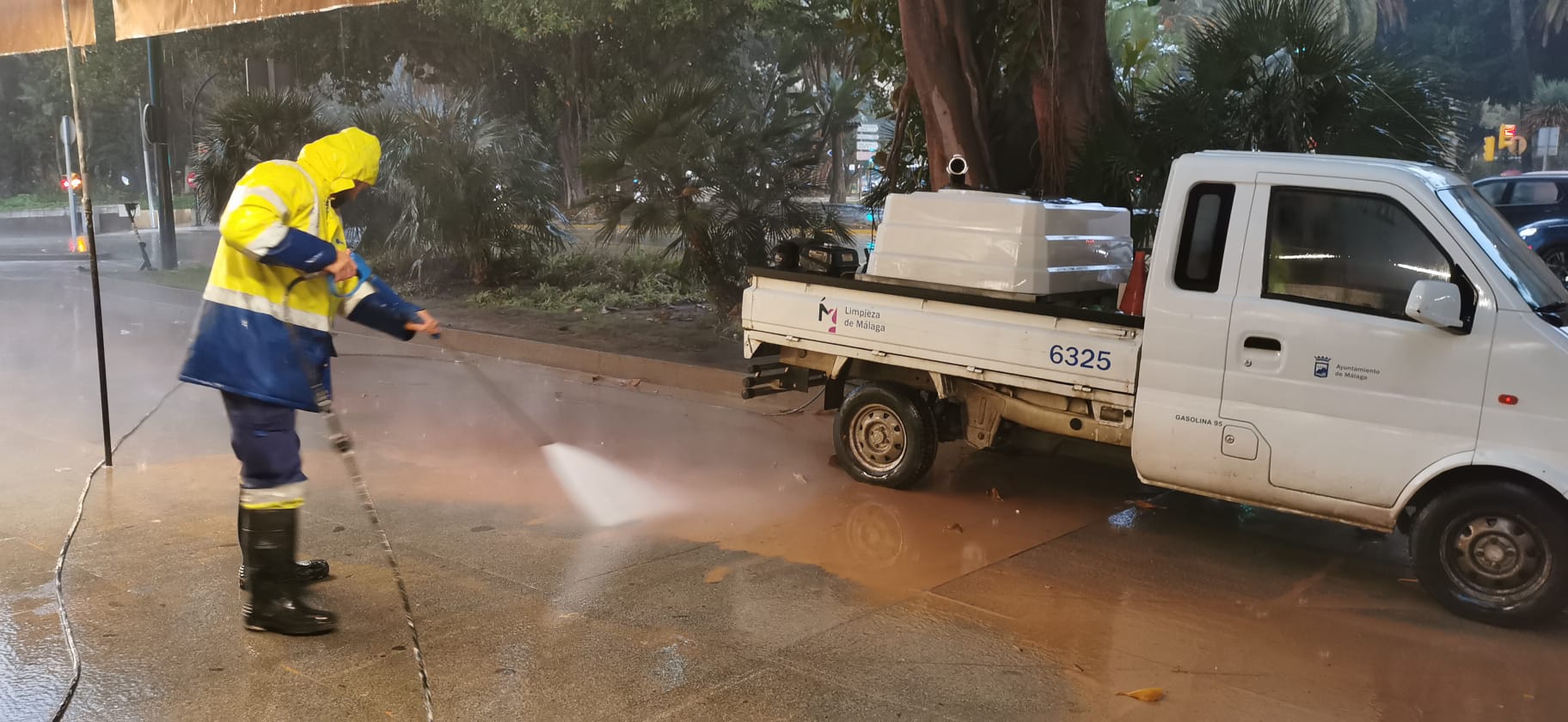 Malaga wakes to cars, buildings and streets covered in red mud