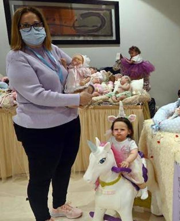 Monica Iriarte with some of the dolls. 
