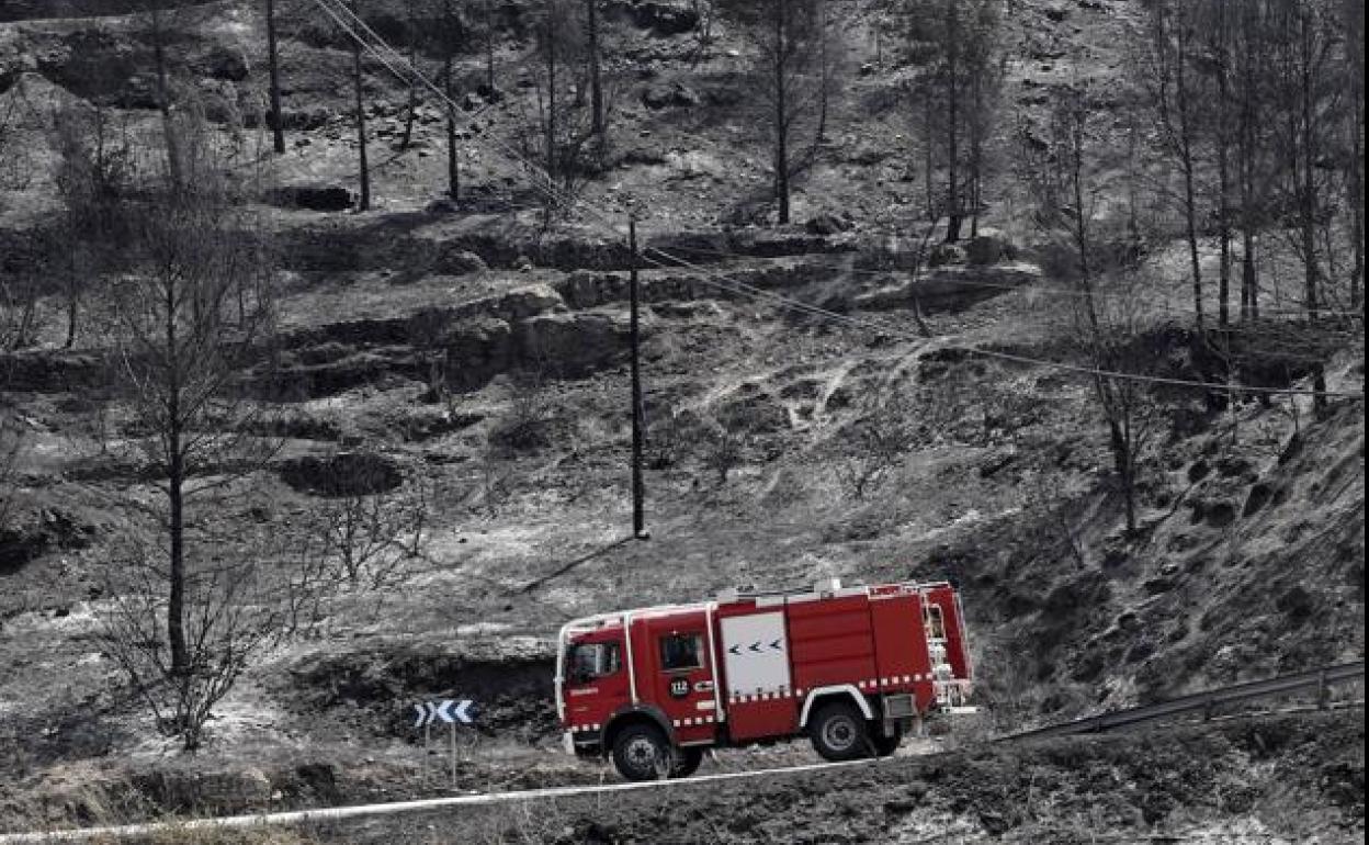 A fire engine passes through an area devastated by the flames in the town of El Pont de Vilomara, earlier this week.