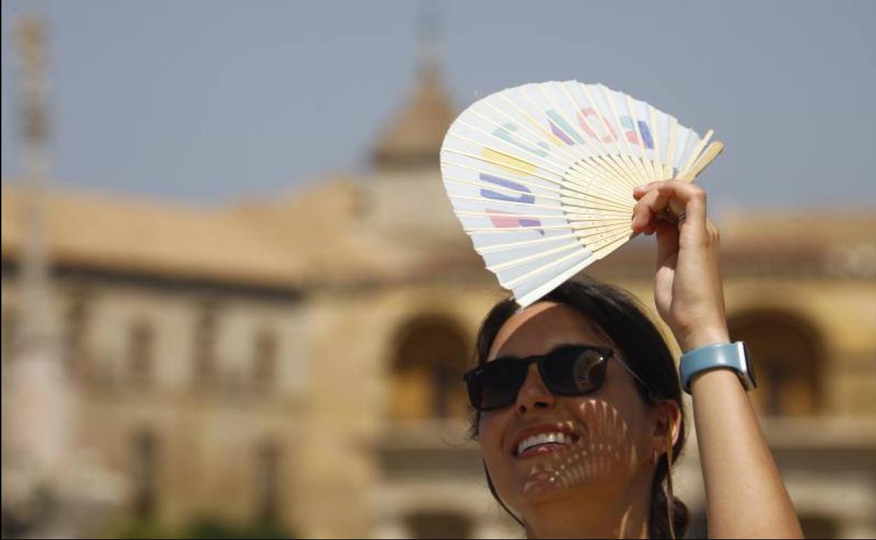 A tourist protects herself from the sun in Cordoba 