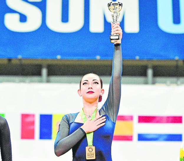 Natalia Baldizzone holds up her third European title. 