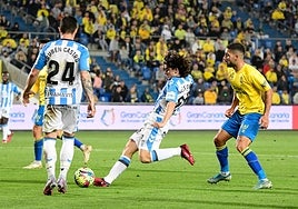 Álex Calvo about to fire the ball into the net for Malaga's equaliser.