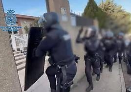 Police spring into action duing the drugs raid.