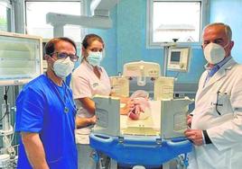 The hospital team with baby Scott who recovered from the procedure with no complications.