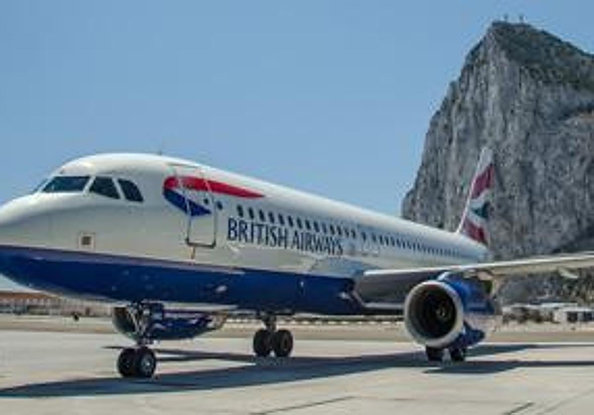 A BA aircraft with a backdrop of the Rock.