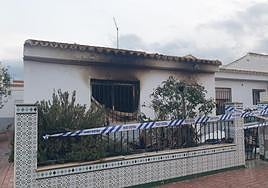 The charred house where the children were found by police.