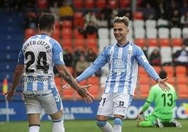 Rubén Castro and Fran Villalba celebrate Malaga CF's second goal against Lugo.