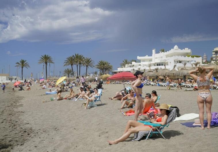 Locals and tourists on a Costa del Sol beach at the weekend.