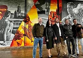 Florido and Gómez, together with the artists at the opening of the mural in Munich.