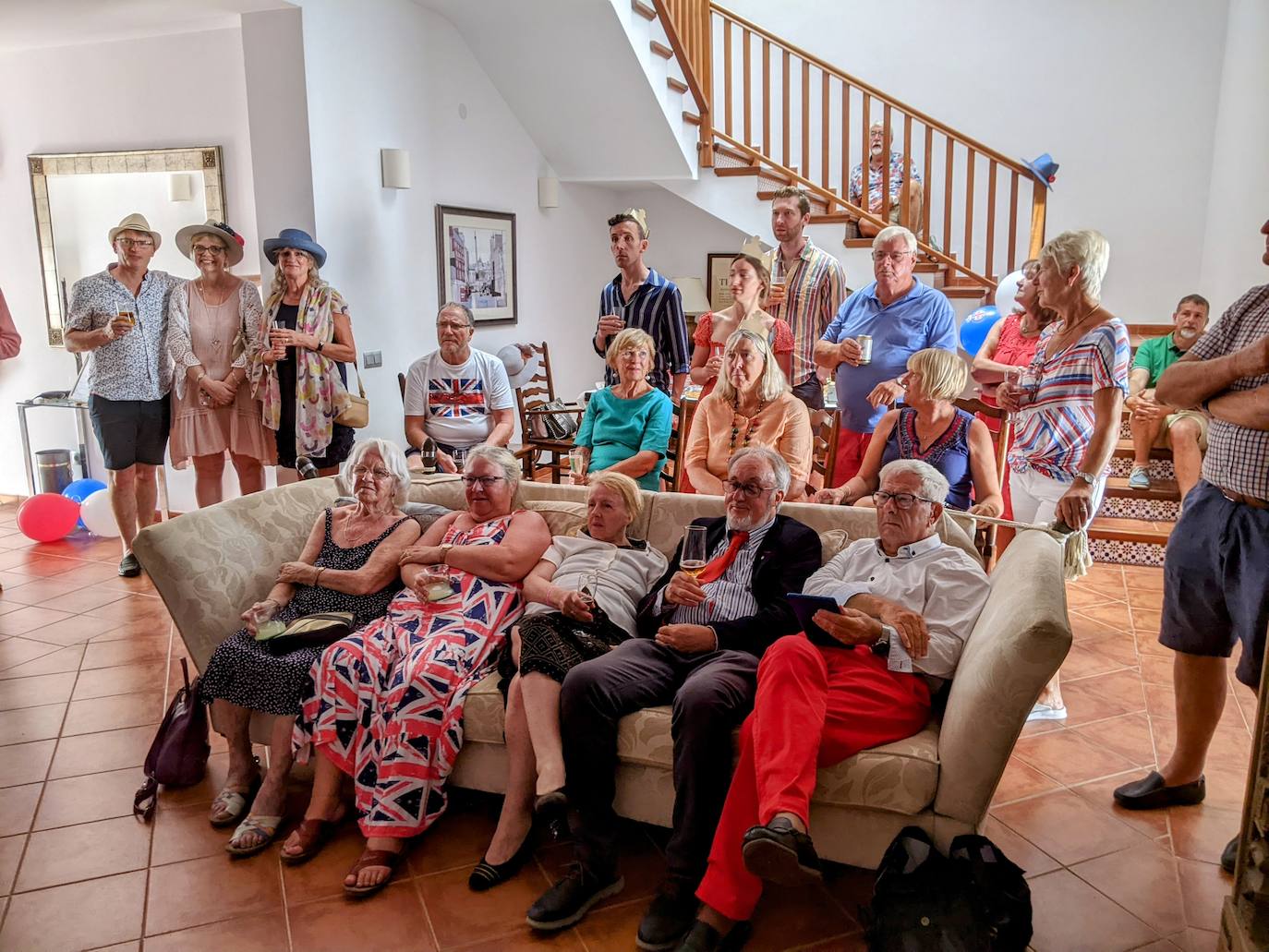 Members watch the coronation