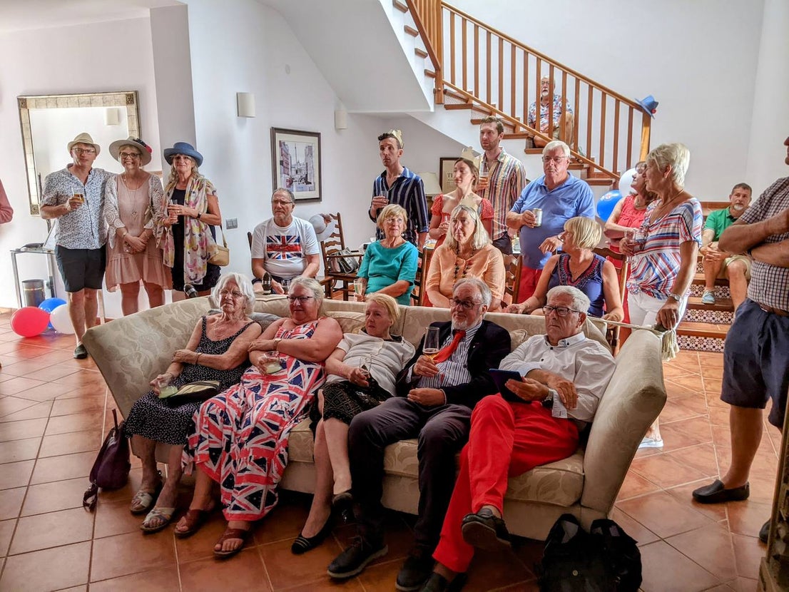Members watch the coronation