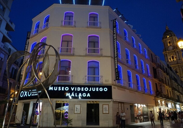 The façade of the video game museum, illuminated at night