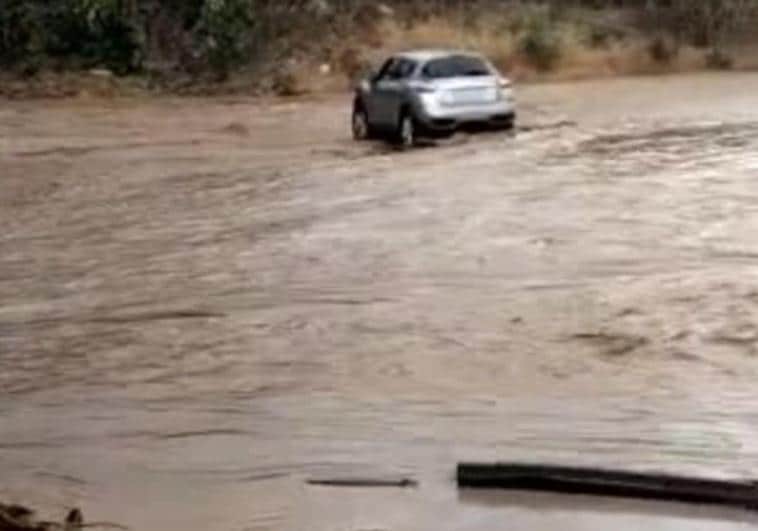 Car trapped in flooded river in Axarquía on Thursday.