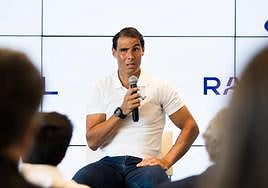 Rafael Nadal talks during a press conference explaining his decision