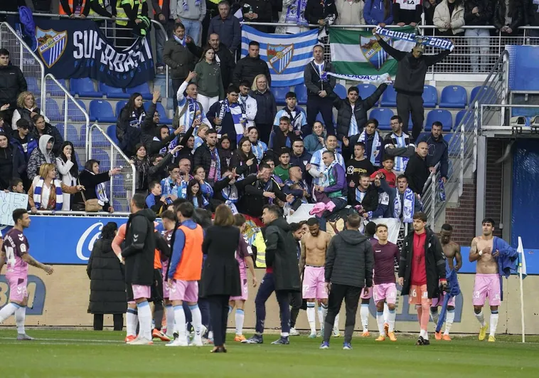 The Malaga players went over to the hundreds of fans who travelled to Vitoria after the game.