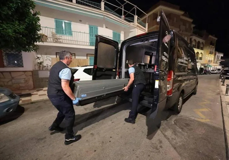 A team arrives to remove the body from the Torremolinos property last night (Tuesday).