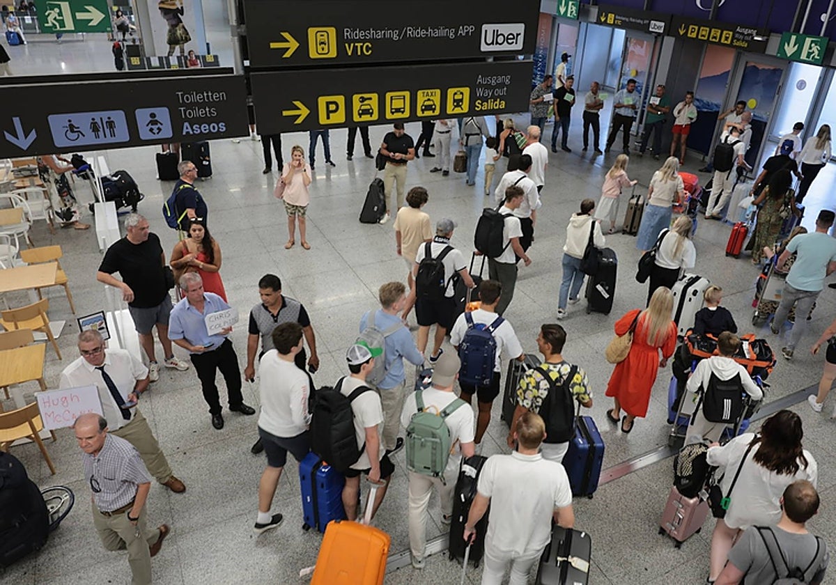Tourists in the arrivals area of Malaga Airport.