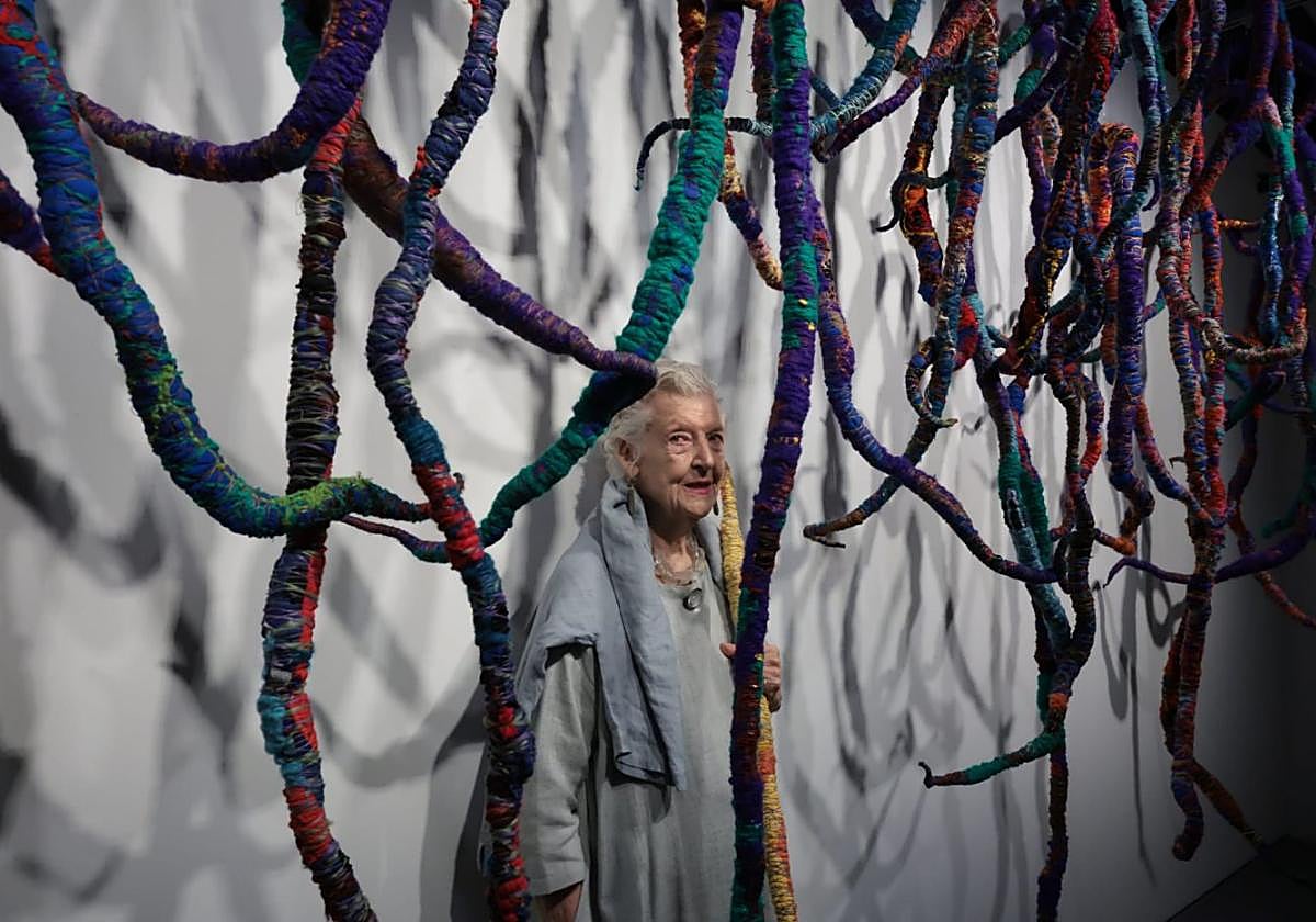 Sheila Hicks with one of her works at the Malaga Pompidou centre.