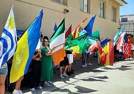 Students parade with the flags of their countries of origin on the multicultural day they hold every year.