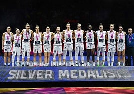 The Spain players on the podium with their runners-up medals.