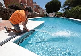 A swimming pool is topped up from a water tanker on Thursday.