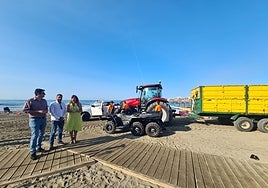 The councillor for Beaches and technicians from the department next to the new machinery.