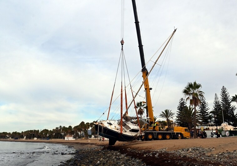 Huge crane finally removes the sailboat stranded on San Pedro beach after almost two-month delay
