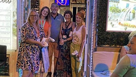 Benalmádena quiz night cash donated to three local charities