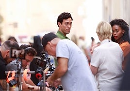 Actor Alex Hassell and actress Nafessa Williams, during filming