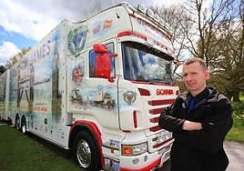 Matthew De-Machen with one of the company's fleet of lorries.