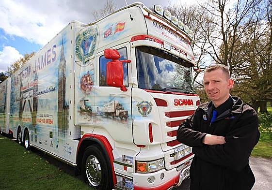 Matthew De-Machen with one of the company's fleet of lorries.