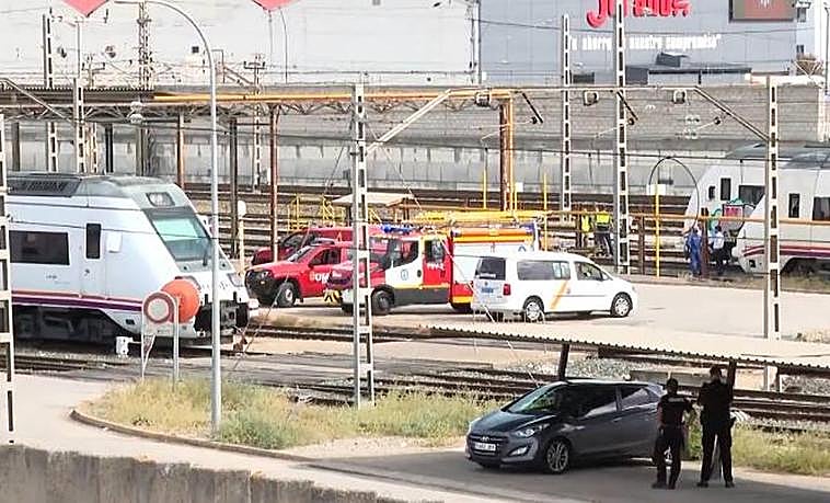 Emergency services at the scene after the young man's body was spotted by a camera crew on live television.