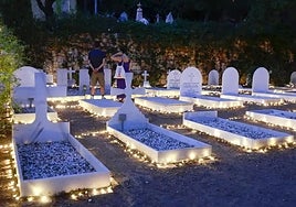 Illuminated tombs in the English Cemetery in Malaga city during one of the open-door activities held this summer.