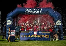 England XI celebrate their victory.