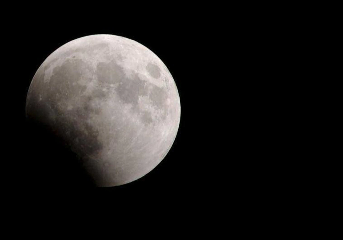 When precisely will the next partial lunar eclipse be visible in Spain?