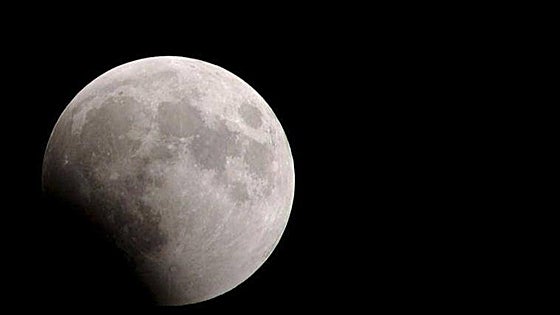 When precisely will the next partial lunar eclipse be visible in Spain?