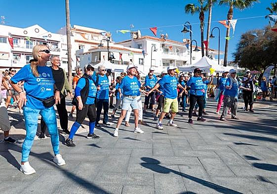 The walkers warm up with a series exercises before setting off.