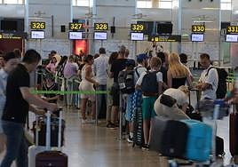 Queues at the check-in desk area at Malaga Airport.