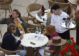 A waiter on a café terrace in Malaga.