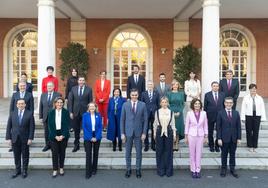 The new cabinet poses outside the PM's official La Moncloa residence in Madrid on Wednesday this week.