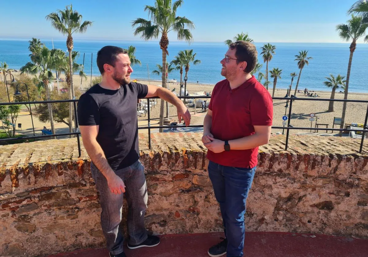 Leandro (left) talks to Cristian González on the roof of the beachside watchtower in La Cala.