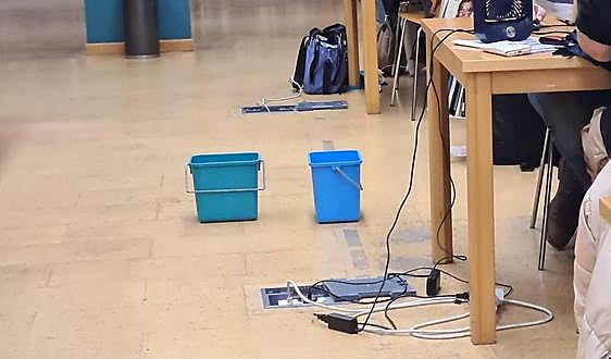 Buckets used to catch rain from leaking roof at Benalmádena library