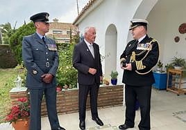 Brian receives his Nuclear Test Medal from military attaché Captain Stephen McGlory.