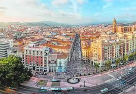 A view of Malaga city centre, with the cathedral, the central Calle Larios and the castle on the hill.