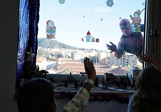 Spider-Man waving to children on one of the wards.